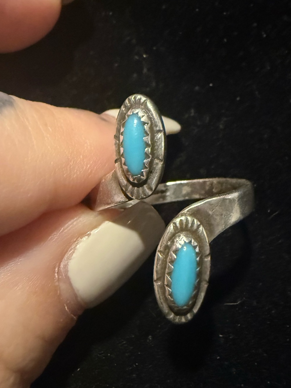 Adjustable native made turquoise and silver ring